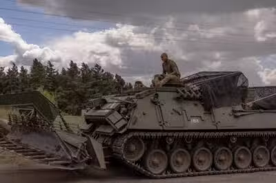 Ukrainian servicemen operate an armoured military vehicle in the Sumy region, near the border with Russia, on August 13, 2024, amid the Russian invasion of Ukraine. Ukraine's shock border offensive into Russia's Kursk region has been one of Ukraine's speediest operations since Moscow invaded in February 2022. Analysts say it is the most significant ground operation by a foreign army inside Russia since World War II. For Ukraine, it has been a morale boost at an otherwise perilous moment in the war. (Photo by Roman PILIPEY / AFP)