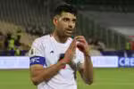 Iran's forward #09 Mehdi Taremi celebrates scoring his team's second goal during the FIFA World Cup 2026 Asia zone qualifiers group A football match between Iran and the North Korea at the Azadi Sports Complex in Tehran on June 10, 2025. (Photo by ATTA KENARE / AFP)
