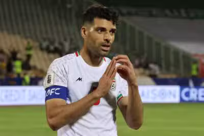Iran's forward #09 Mehdi Taremi celebrates scoring his team's second goal during the FIFA World Cup 2026 Asia zone qualifiers group A football match between Iran and the North Korea at the Azadi Sports Complex in Tehran on June 10, 2025. (Photo by ATTA KENARE / AFP)