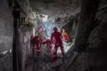 Rescuers sift through the rubble inside in the Evin prison complex in Tehran that was hit days ago by an Israeli strike, on June 25, 2025. The Israeli defence minister announced strikes on the prison and other domestic security agencies in Tehran on June 23. (Photo by Mostafa Roudaki / mizanonline / AFP)