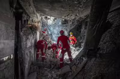 Rescuers sift through the rubble inside in the Evin prison complex in Tehran that was hit days ago by an Israeli strike, on June 25, 2025. The Israeli defence minister announced strikes on the prison and other domestic security agencies in Tehran on June 23. (Photo by Mostafa Roudaki / mizanonline / AFP)