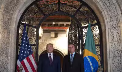 US President Donald Trump (L) speaks with reporters alongside Brazilian President Jair Bolsonaro during a dinner at Mar-a-Lago in Palm Beach, Florida, on March 7, 2020. (Photo by JIM WATSON / AFP)